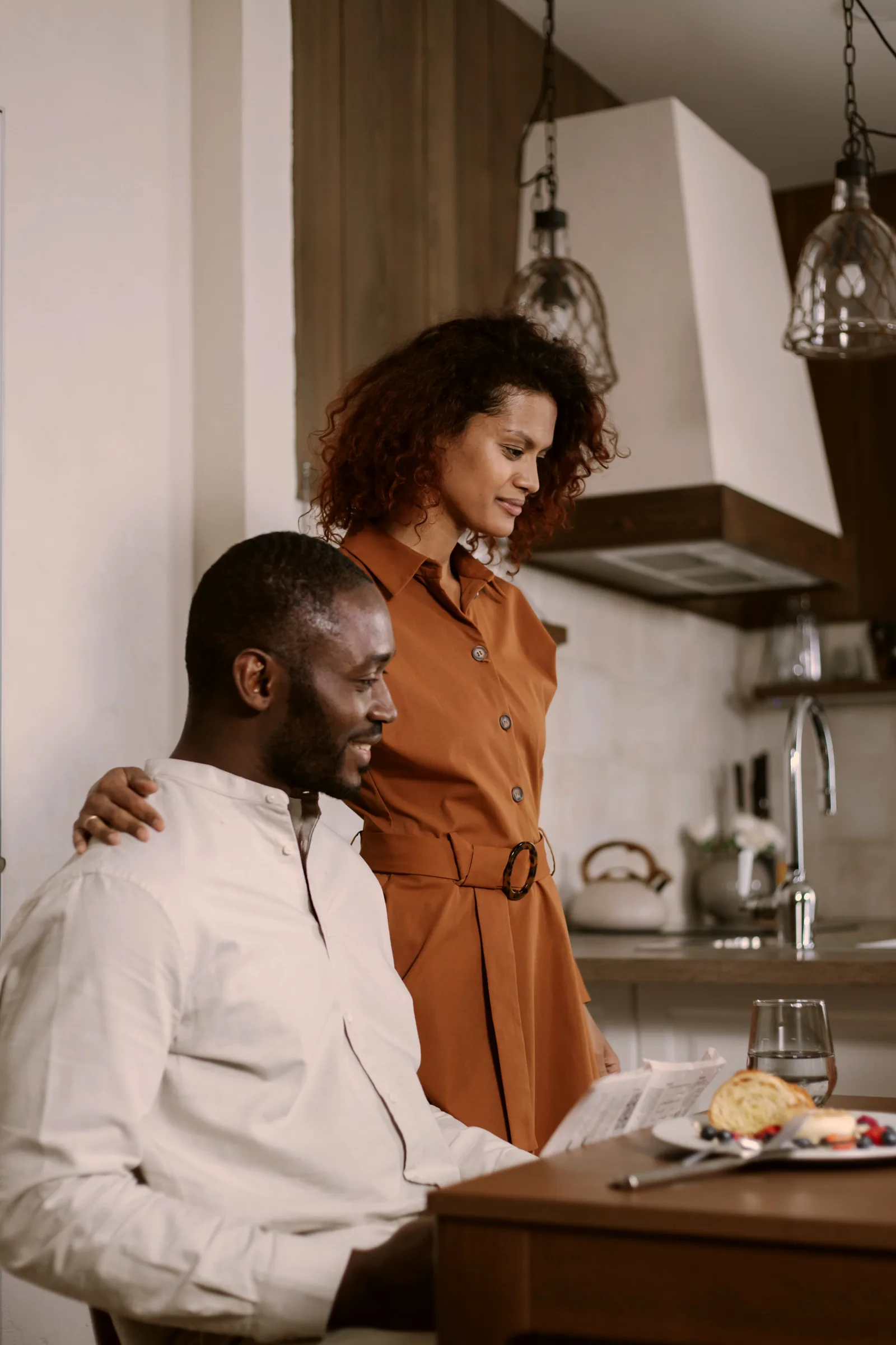 A couple sharing breakfast in their kitchen
